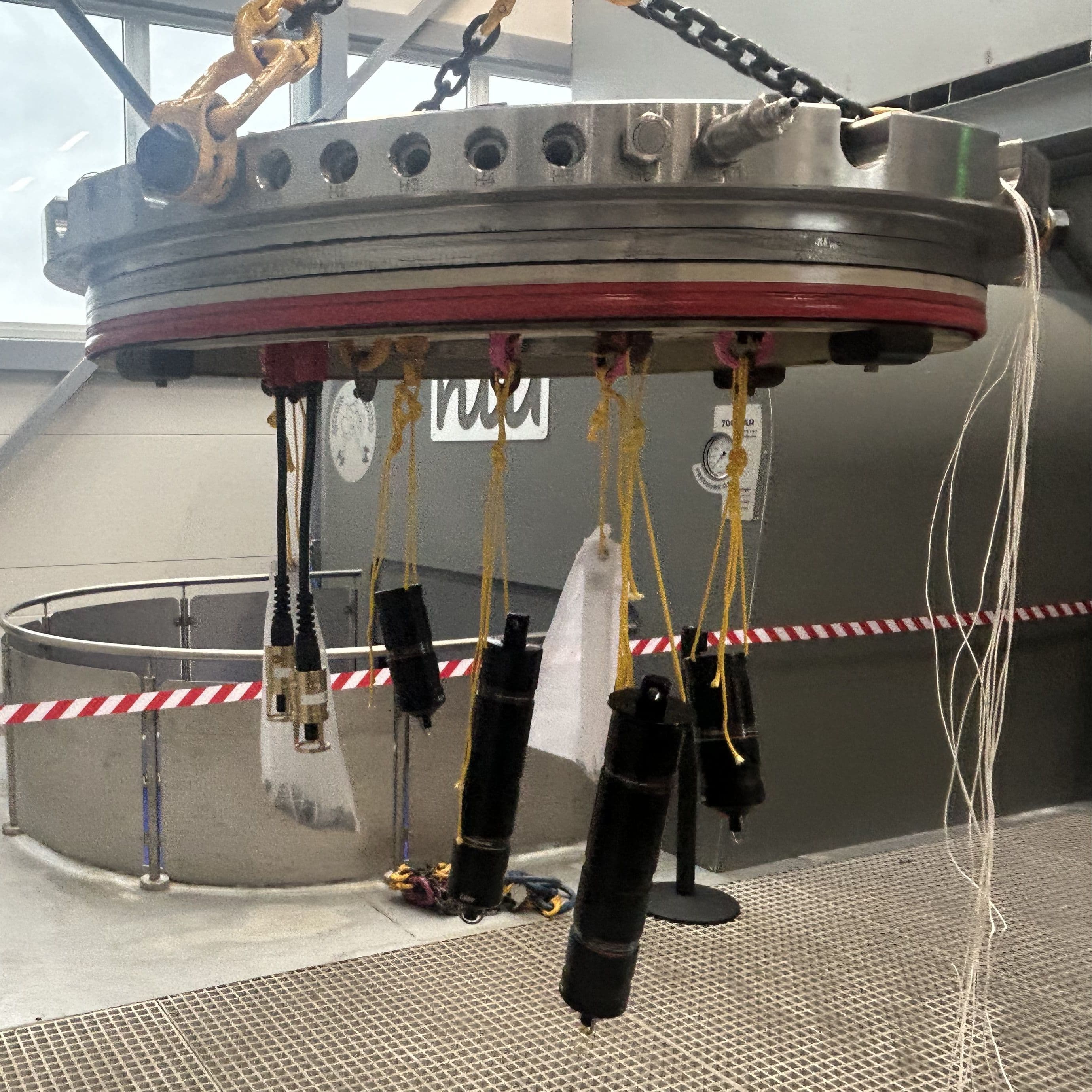 Figure 1 – Equipment suspended from pressure test tank lid.